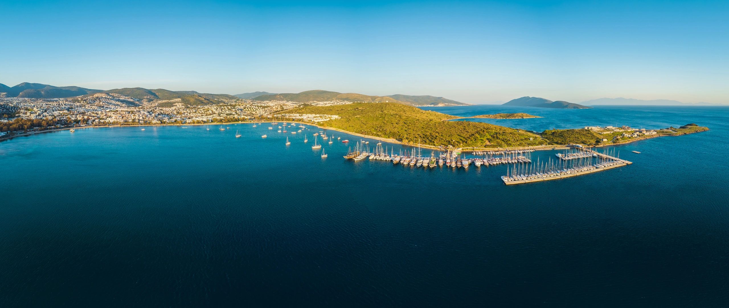 Panoramic aerial view of a marina and turquoise sea